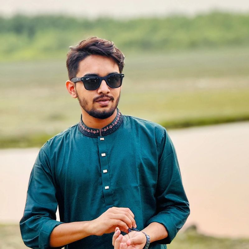 Wasif Shahed in a teal kurta and sunglasses